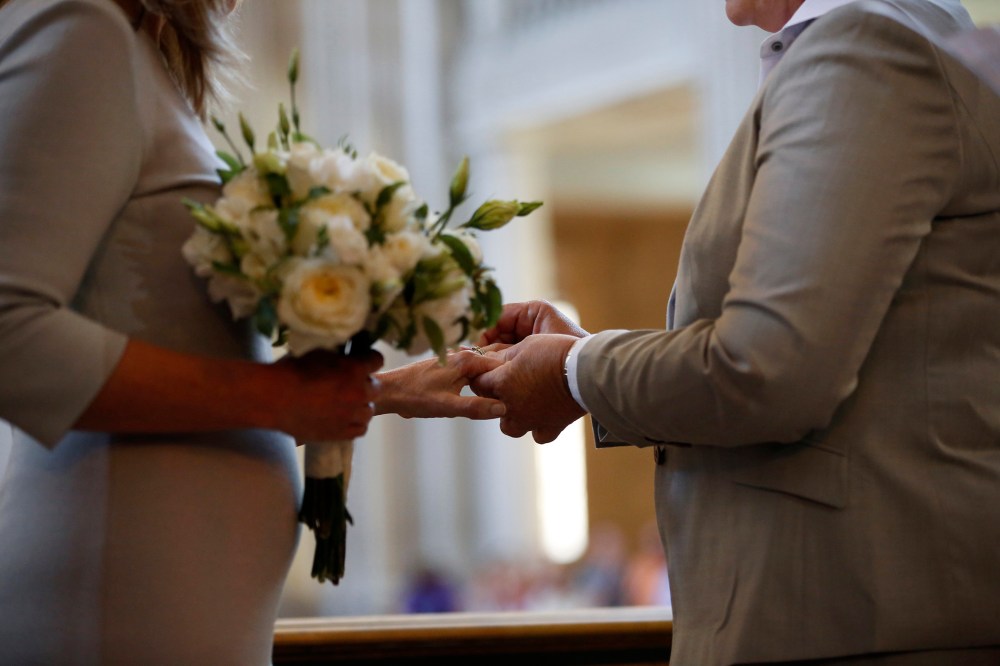 A couple exchange wedding rings at City Hall in San Francisco, on June 28, 2013.