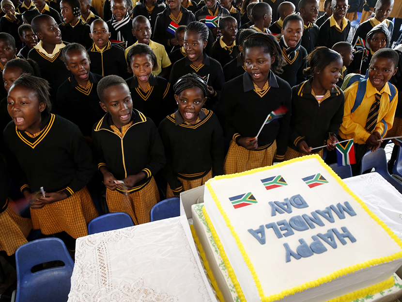 Children sing Happy Birthday to former President Nelson Mandela at a school in Atteridgevile near Pretoria, July 18, 2013. (Photo by Mike Hutchings/Reuters)