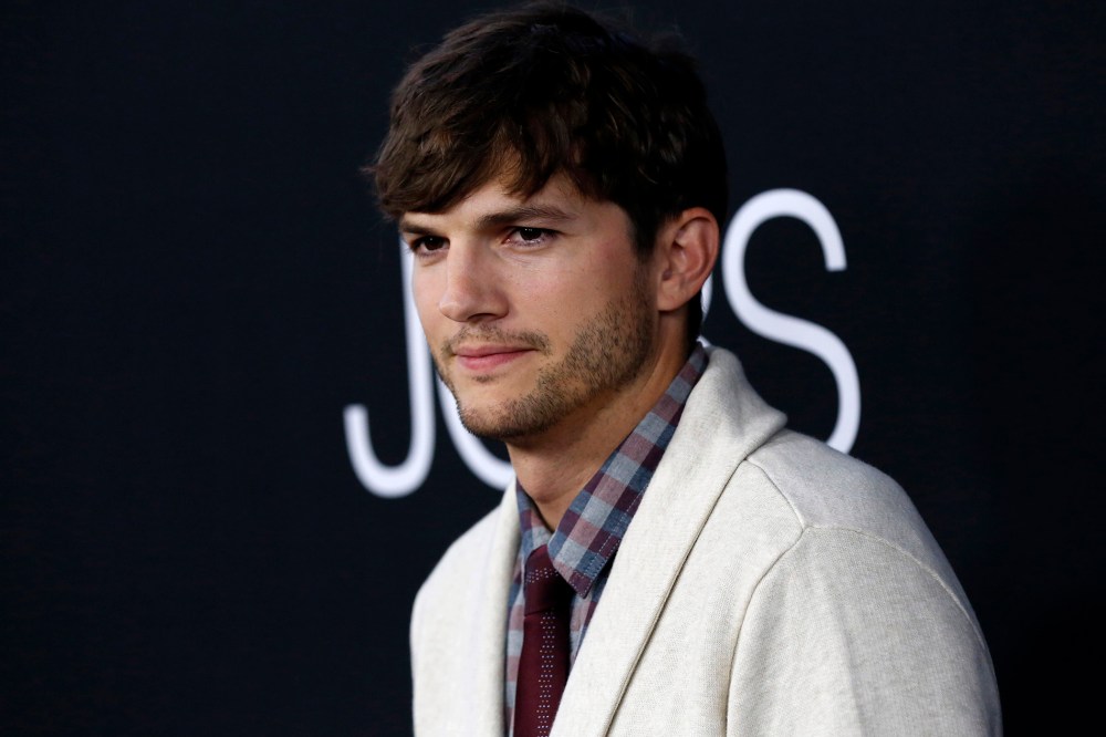 Cast member Ashton Kutcher poses at the premiere of "Jobs" in Los Angeles, Calif on Aug. 13, 2013.