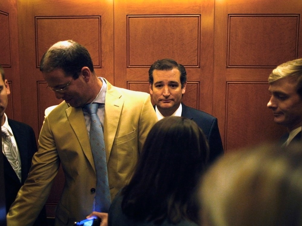 U.S. Senator Cruz departs in an elevator after speaking to reporters about his opposition after the Senate passed a spending bill to avoid a government shutdown at the U.S. Capitol in Washington