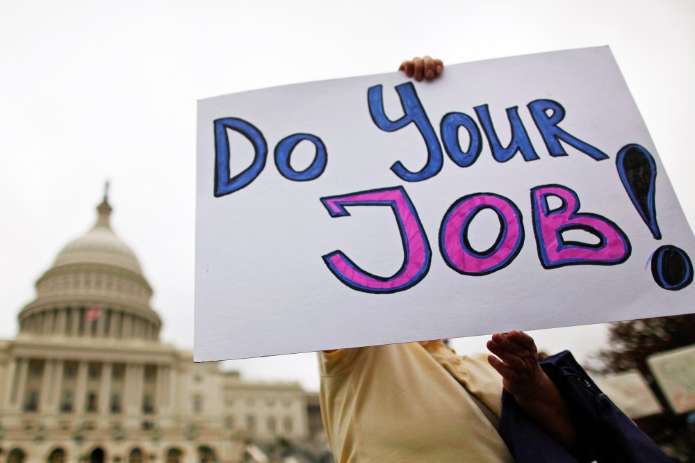 Federal workers demonstrate for an end to the U.S. government shutdown on the west front of the U.S. Capitol in Washington, October 13, 2013.