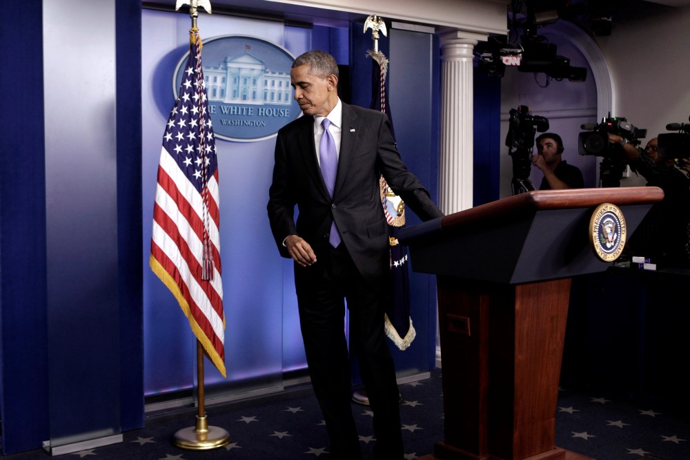U.S. President Barack Obama leaves the briefing room of the White House in Washington on Oct. 16, 2013.