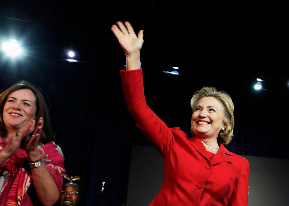 Hillary Clinton waves to the audience at an event to endorse Virginia gubernatorial candidate Terry McAuliffe at The State Theatre in Falls Church, Virginia, October 19, 2013.