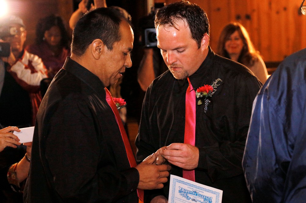 Darren Black Bear and Jason Pickel exchange rings they are married in El Reno, Oklahoma, Oct, 31, 2013.