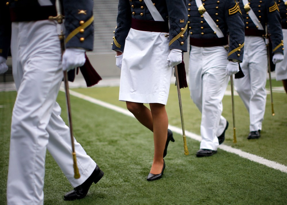 A female cadet marches with other cadets for their graduation ceremony on May 24, 2013.