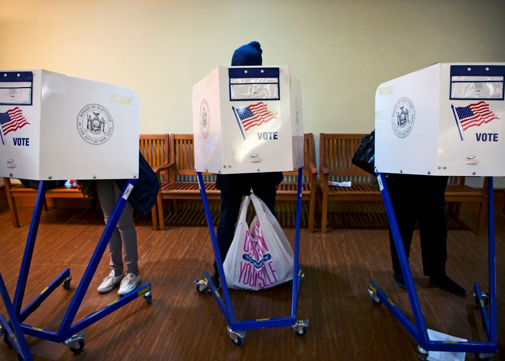 People cast their votes in New York November 5, 2013.