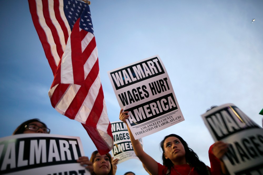Karen Gariel (C), 15, takes part in a protest for better wages outside Walmart in Los Angeles on Nov. 7, 2013.