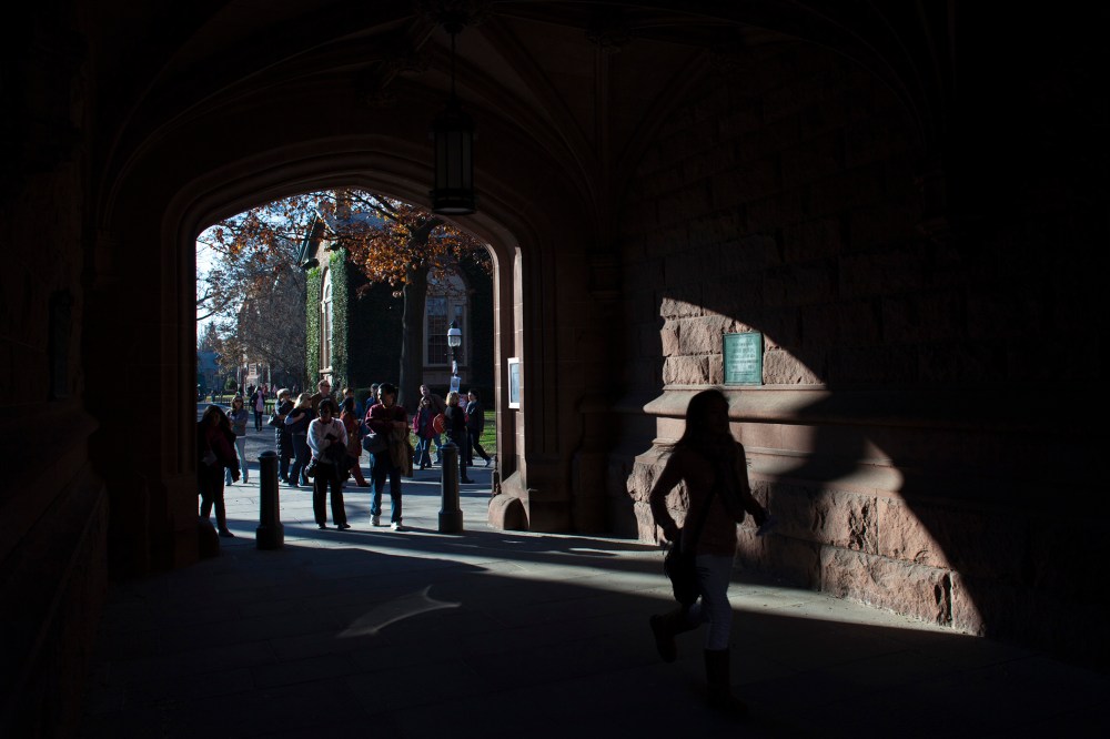 People walk around the Princeton University campus in New Jersey, Nov. 16, 2013.