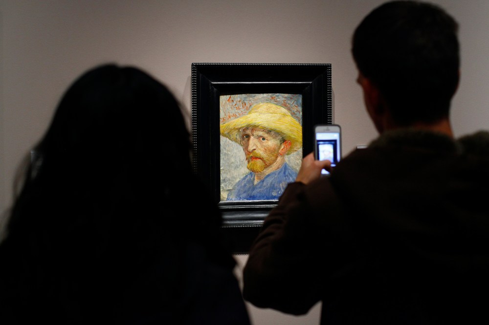 A couple looks at a painting titled "Self Portrait" by artist Vincent van Gogh displayed at the Detroit Institute of Arts in Detroit, Mich. on Dec. 7, 2013.