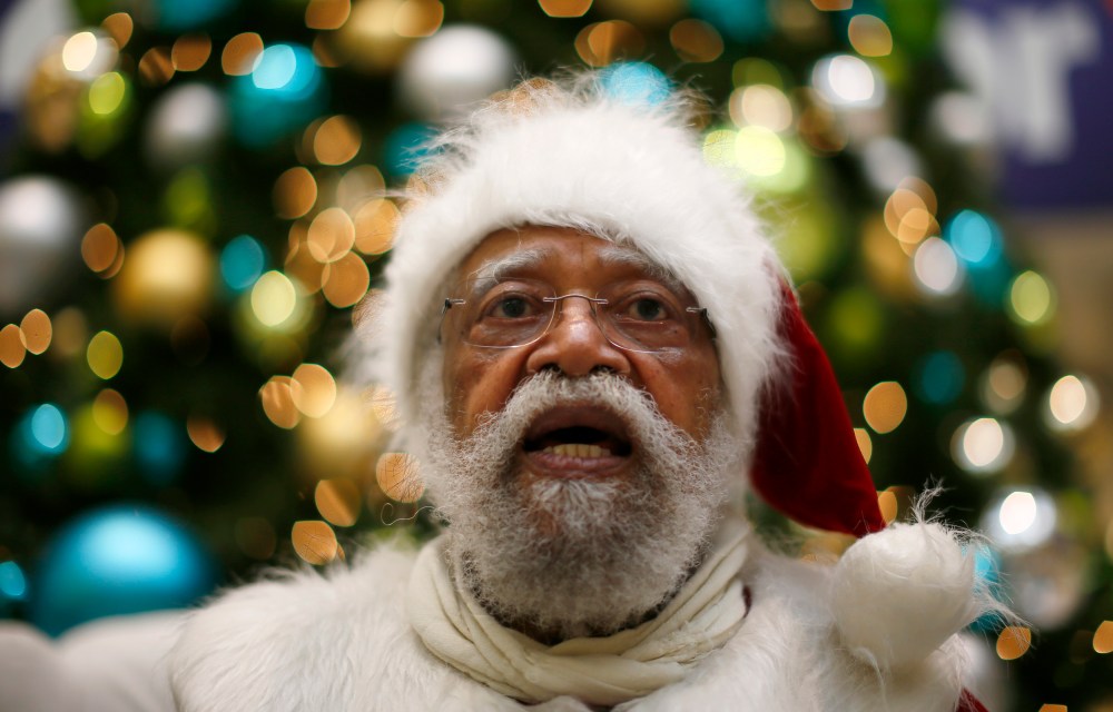 African American Santa Claus Langston Patterson, 77, waits for children to arrive at Baldwin Hills Crenshaw Plaza mall in Los Angeles, Dec. 16, 2013.