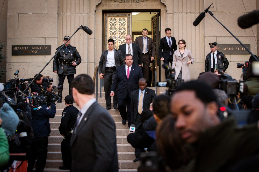 New Jersey Governor Chris Christie (C) departs City Hall in Fort Lee, N.J. on Jan. 9, 2014.