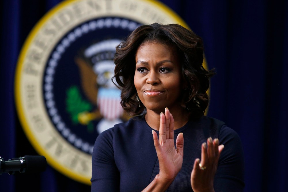 First lady Michelle Obama applauds as she gives remarks during an event, Jan. 16, 2014, in Washington, D.C.