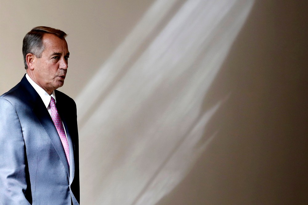 U.S. Speaker of the House John Boehner walks to his weekly news conference on Capitol Hill in Washington, Feb. 6, 2014.