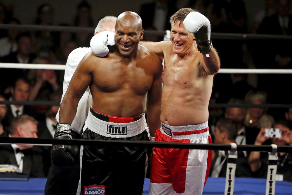 Former Massachusetts Governor Mitt Romney and five-time heavyweight champion Evander Holyfield celebrate after their boxing match in Salt Lake City, Ut. on May 15, 2015. (Photo by Jim Urquhart/Reuters)