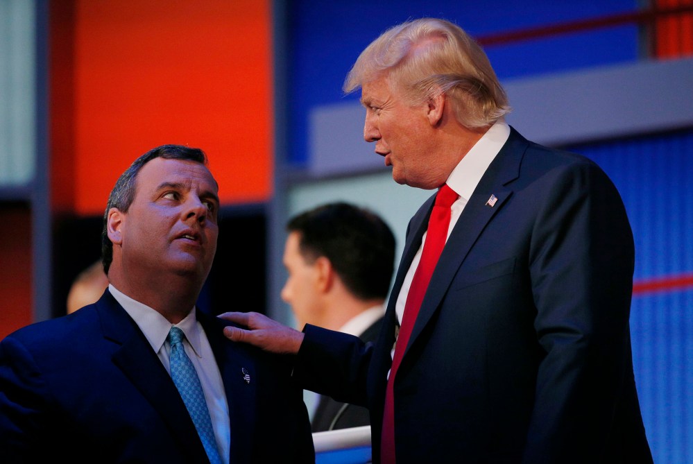 Republican 2016 U.S. presidential candidates Chris Christie and Donald Trump talk during a commercial break in the first official Republican presidential debate of the 2016 campaign in Cleveland, Ohio, Aug. 6, 2015. (Photo by Brian Snyder/Reuters)
