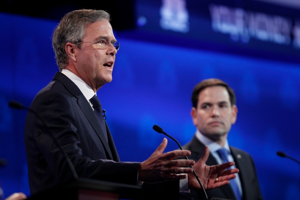 Republican U.S. presidential candidate former Governor Jeb Bush speaks as U.S. Senator Marco Rubio looks on at the 2016 U.S. Republican presidential candidates debate held by CNBC in Boulder, Colo, Oct. 28, 2015. (Photo by Rick Wilking/Reuters)
