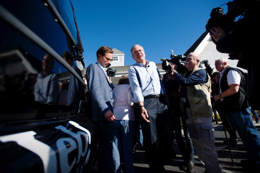 Republican presidential candidate Jeb Bush walks back to his bus after visiting Hollis Pharmacy in Hollis, N.H., Nov. 4, 2015. (Photo by Gretchen Ertl/Reuters)