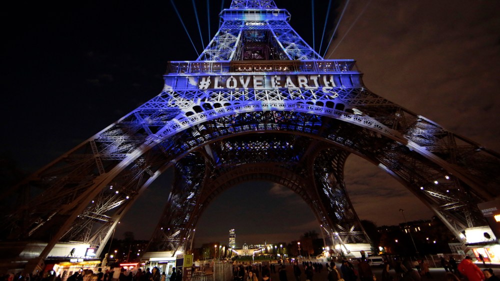 The Eiffel Tower is lit with blue lights as part of the events in the French capital to mark the World Climate Change Conference 2015 (COP21), in Paris, France, Dec. 2, 2015. (Photo by Eric Gaillard/Reuters)