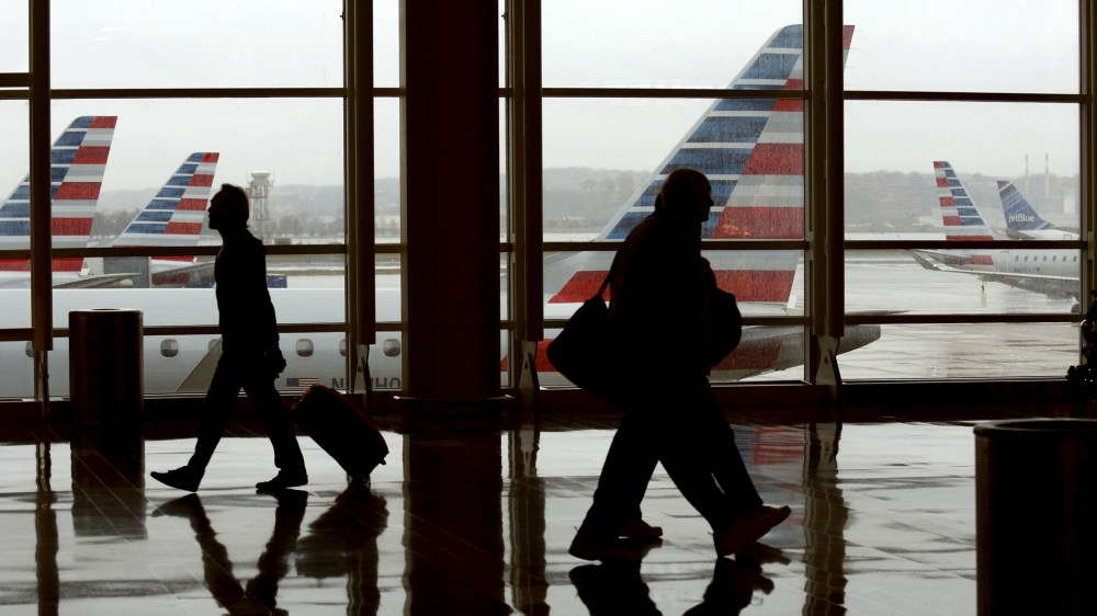 Travelers make their way through Reagan National Airport in Washington, D.C., on Dec. 23, 2015. (Photo by Kevin Lamarque/Reuters)
