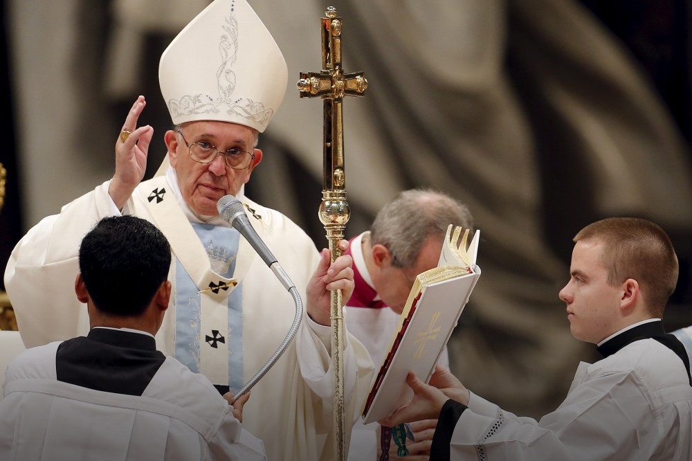 Pope Francis blesses at the end of a mass on New Year's Day at Saint Peter's Basilica at the Vatican, Jan. 1, 2016. (Photo by Giampiero Sposito/Reuters)