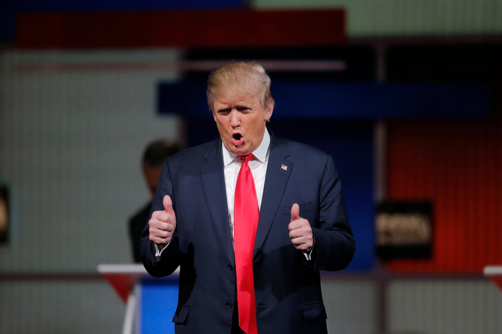 Republican U.S. presidential candidate and businessman Donald Trump gives a thumbs up to the crowd during the Fox Business Network Republican presidential candidates debate in North Charleston, S.C., Jan. 14, 2016. (Photo by Chris Keane/Reuters)