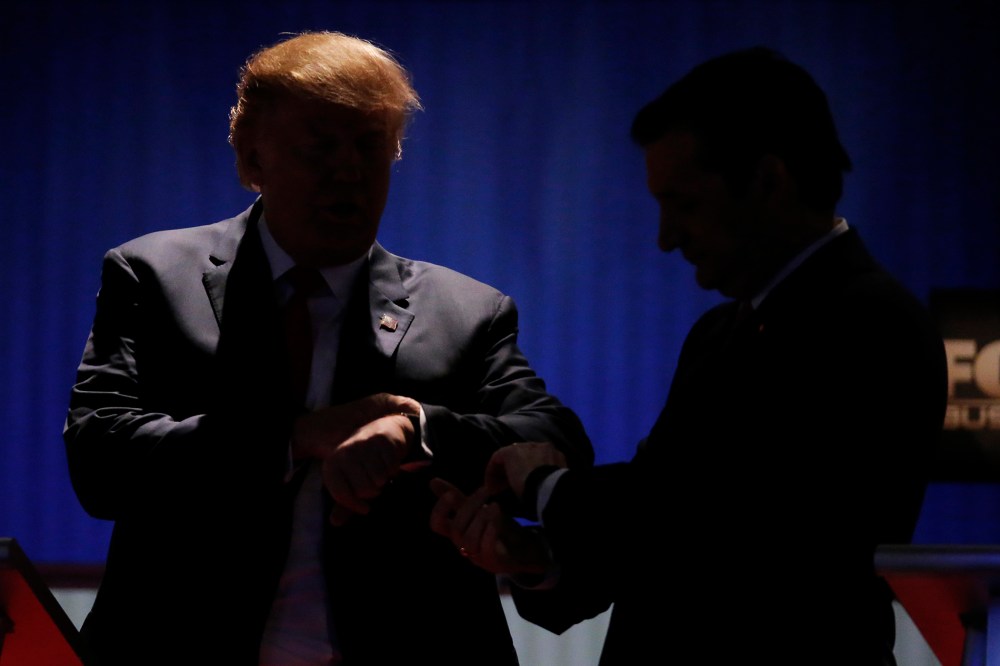 Republican U.S. presidential candidates Donald Trump and Senator Ted Cruz check their watches during a break at the sixth Republican presidential candidates debate in North Charleston, S.C., Jan. 14, 2016. (Photo by Chris Keane/Reuters)