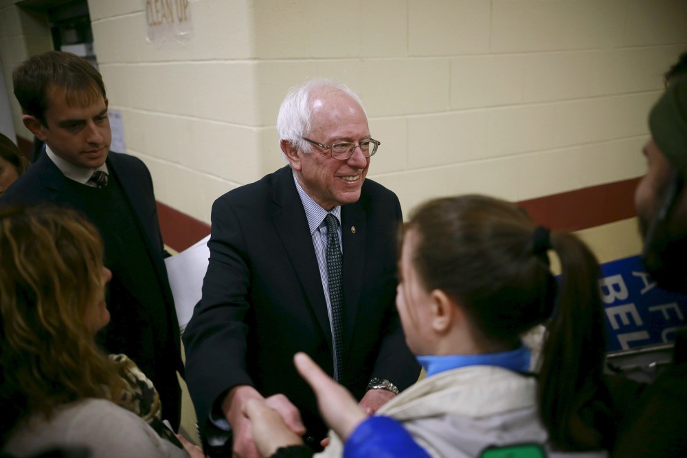 U.S. Democratic presidential candidate Senator Bernie Sanders shakes hands with an attendee during a campaign town hall meeting in Bedford, N.H. Jan. 22, 2016. (Photo by Katherine Taylor/Reuters)