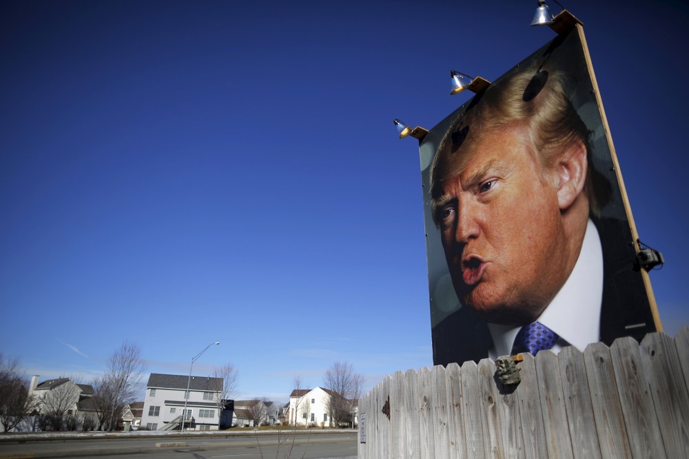 A large poster of Republican presidential candidate Donald Trump is displayed in a residential neighborhood in West Des Moines, Iowa, Jan. 28, 2016. (Photo by Brian Snyder/Reuters)