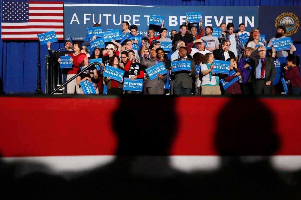 Shadows loom over supporters of Democratic presidential candidate Bernie Sanders at his 2016 New Hampshire presidential primary night rally in Concord, N.H., Feb. 9, 2016. (Photo by Shannon Stapleton/Reuters)