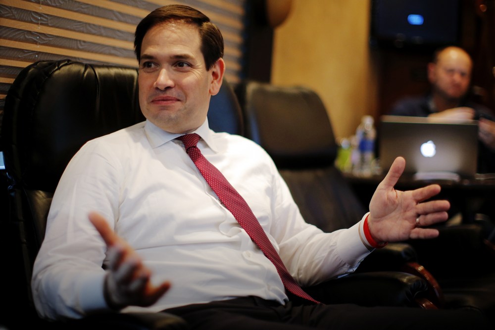 Republican presidential candidate Marco Rubio speaks with members of the media on his campaign bus between stops in S.C., Feb. 15, 2016. (Photo by Chris Keane/Reuters)