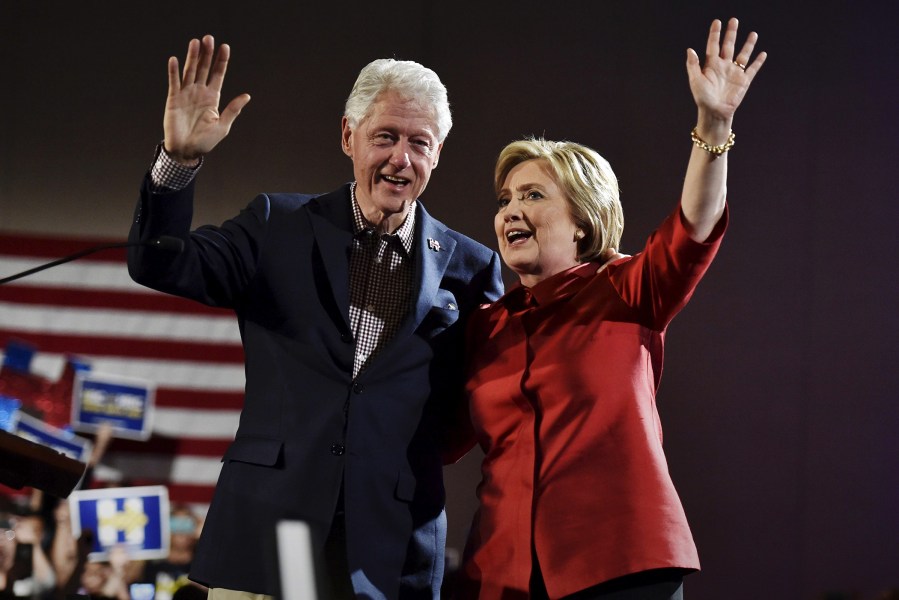Democratic presidential candidate Hillary Clinton and her husband former President Bill Clinton wave to supporters in Las Vegas, Nev., Feb. 20, 2016. (Photo by David Becker/Reuters)