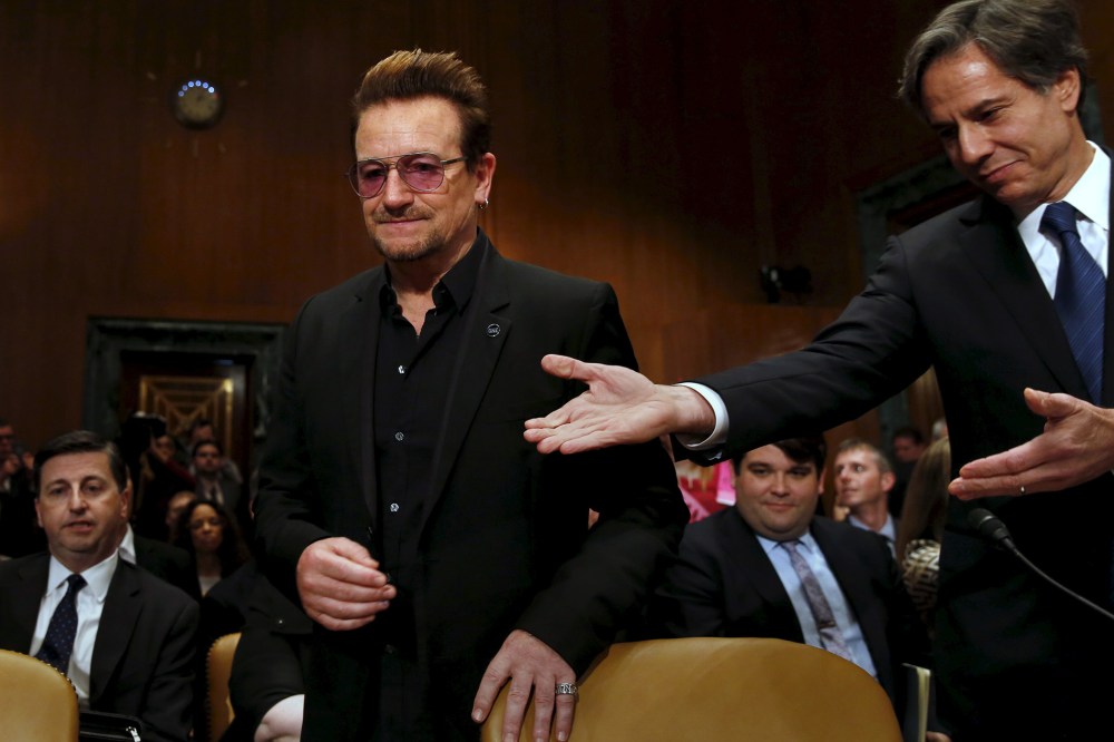 Deputy Secretary of State Antony Blinken welcomes U2 lead singer Bono to testify before a Senate subcommittee hearing on Capitol Hill in Washington, April 12, 2016. (Photo by Yuri Gripas/Reuters)