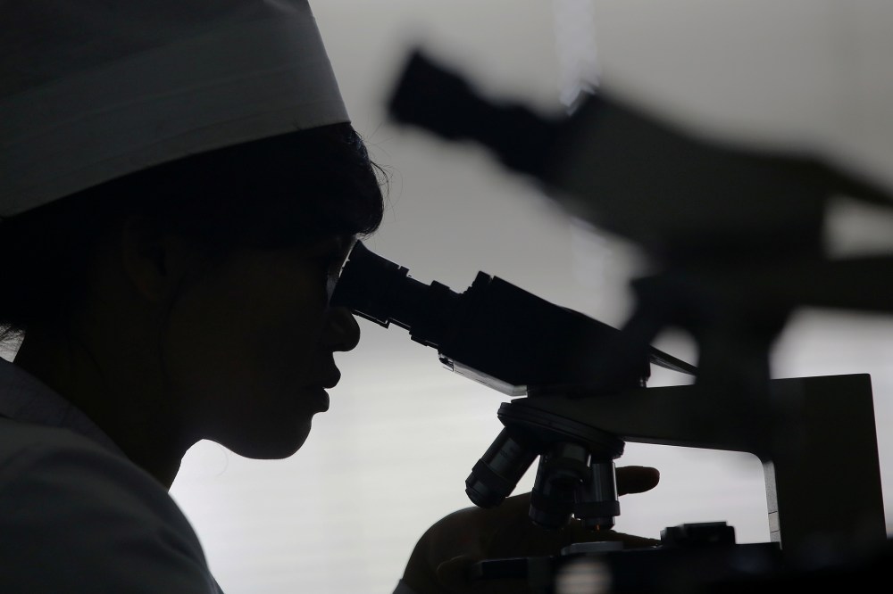A doctor uses a microscope on May 7, 2016. (Photo by Damir Sagolj/Reuters)