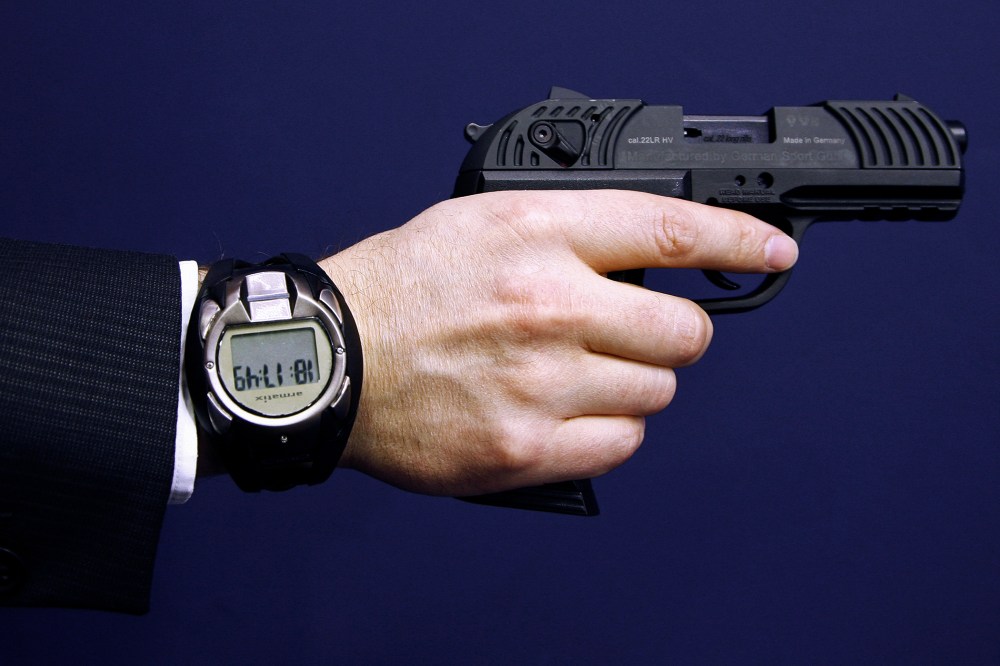 A man holds a prototype of a smart gun by Armatix during the International Guns Exhibition Nuremberg, March 13, 2009.