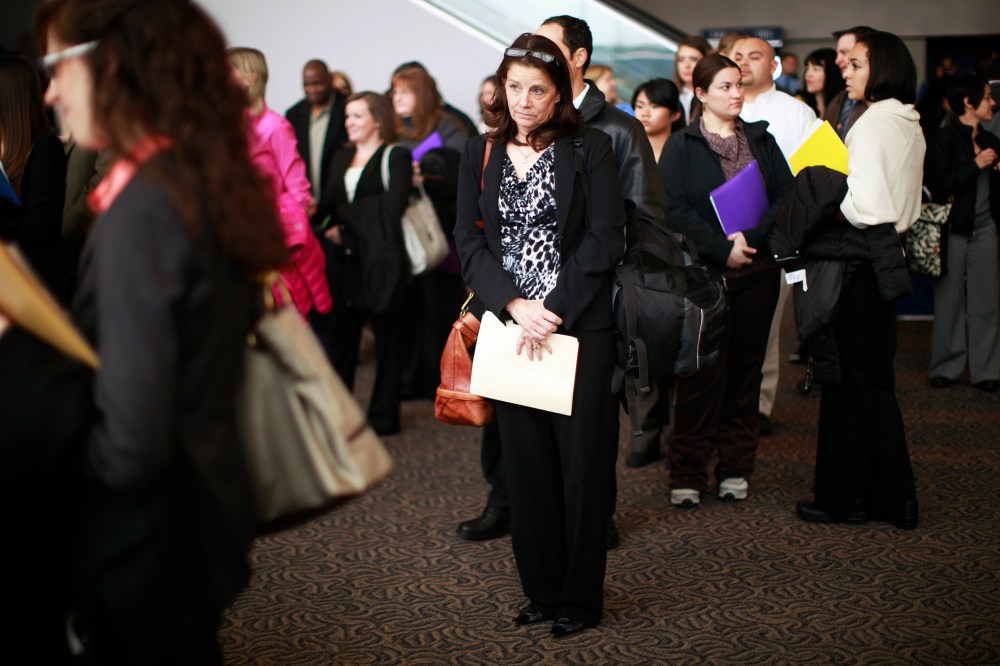Job seekers listen to a presentation at the Colorado Hospital Association health care career fair in Denver April 9, 2013.
