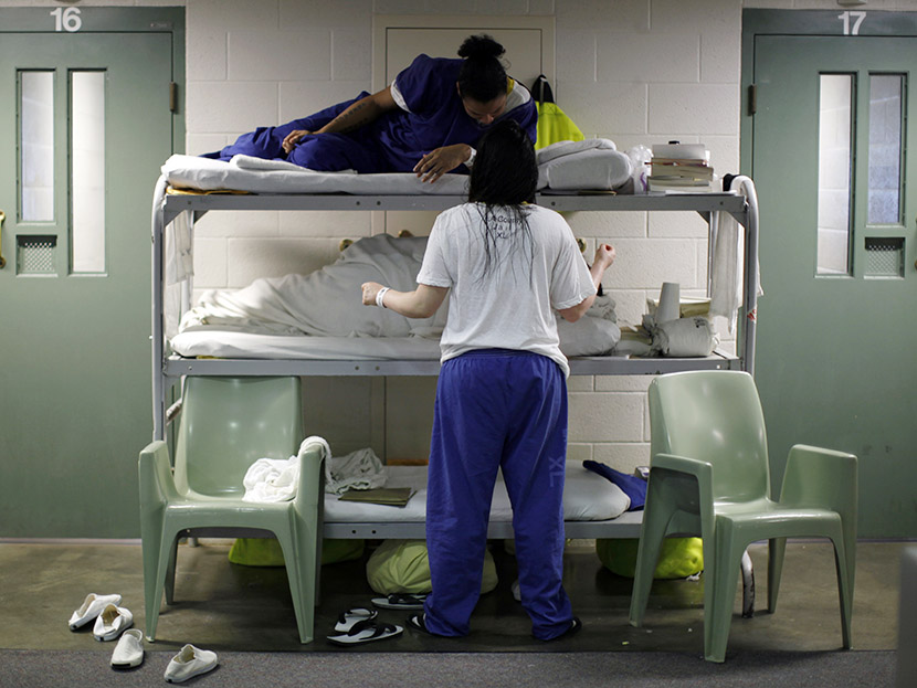 Women chat as they lie in beds placed in the communal area outside cells, due to overcrowding at the Los Angeles County Women's jail in Lynwood, California April 26, 2013. (Photo by Lucy Nicholson/Reuters)
