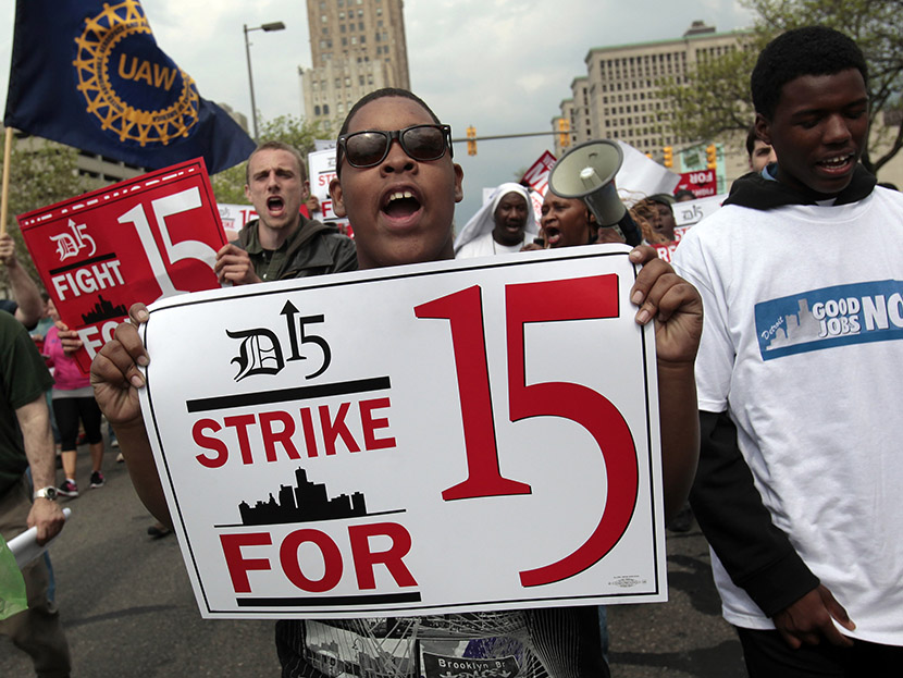 A group of workers and labor activists march down West Grand Boulevard as they demand a raise in the minimum wage for fast food workers in Detroit, Michigan May 10, 2013.  (Photo by Rebecca Cook/Reuters)