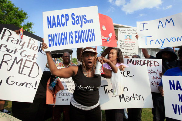 Protestor Rene Panko holding up a sign at Thursday's big rally.