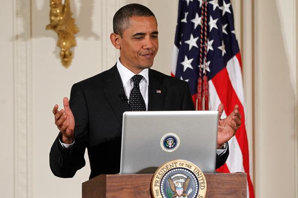 President Obama tweeting during a "Twitter Town Hall" at the White House in July 2011.