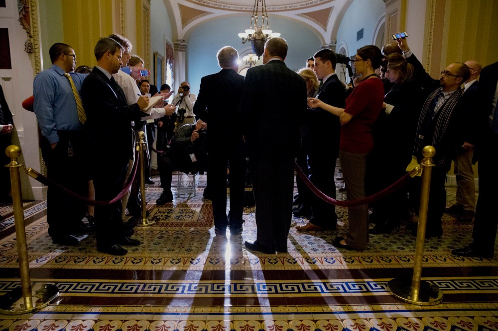 Senator Lamar Alexander, R-Tenn., having done an about-face on the filibuster since President Obama took office, looks over the shoulder of Senate Minority Leader Mitch McConnell of Ky., during a news conference on Capitol Hill in Washington, November 21,
