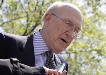 This April 14, 2011 file photo shows Alan Simpson, then- co-chairmen of the president's deficit reduction commission, talking to reporters outside the White House in Washington. (AP Photo/Carolyn Kaster, File)
