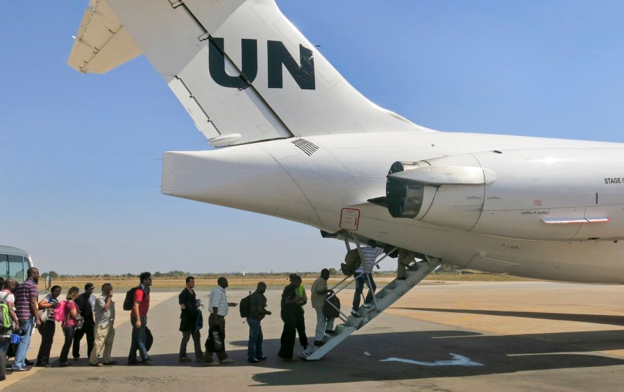 In this photo taken Sunday, Dec. 22, 2013 and released by the United Nations Mission in South Sudan (UNMISS) on Monday, Dec. 23, 2013, UNMISS relocates non-critical staff from Juba, South Sudan, to Entebbe, Uganda.