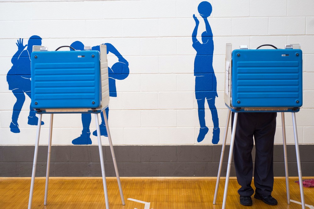 A voter fills out a ballot at Thomas Jefferson Elementary School in Forest, Va., on election day, Nov. 3, 2015. (Photo by Autumn Parry/News & Daily Advance/AP)
