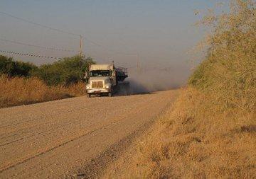 A truck on a gravel road near La Joya, Texas.
