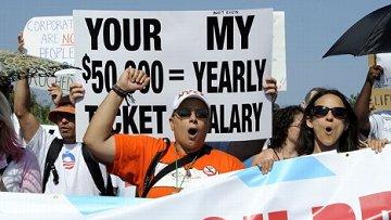 Protesters outside Romney's fundraisers at the Hamptons.