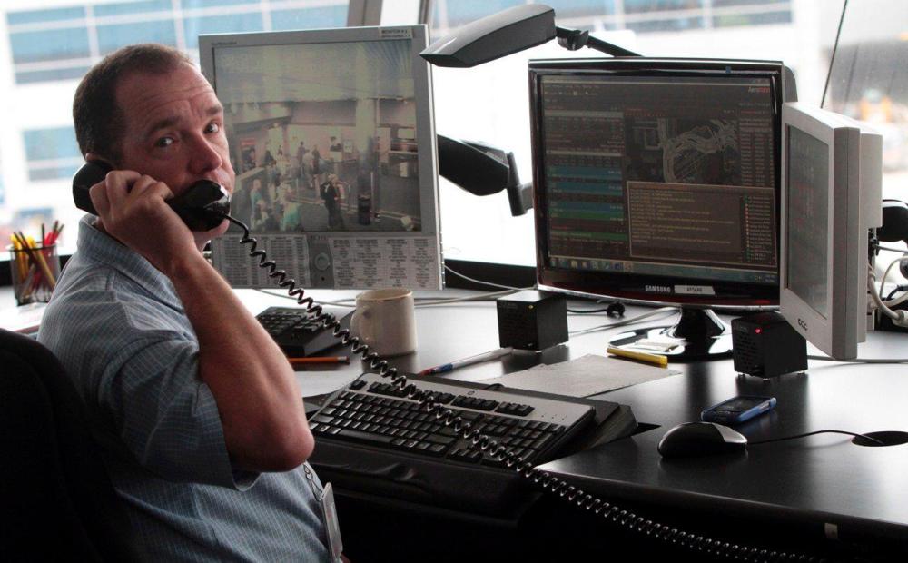 An American Airlines employee works in the airlines control tower at JFK International airport in New York on Aug. 1, 2012.