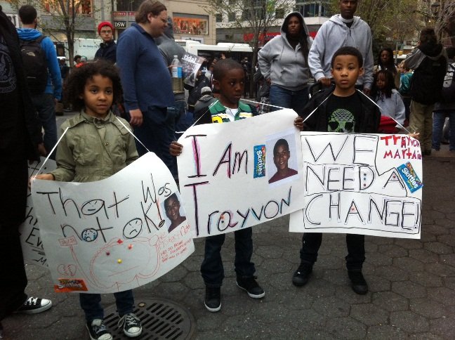 Demonstrators gather to march in New York City in memory of an unarmed black teenager shot to death by a neighborhood watch captain in Florida.