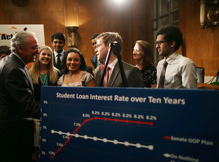 Senate Health, Education, Labor and Pensions Committee Chairman Tom Harkin (D-IA)(L) talks with students during a news conference on Capitol Hill, June 6, 2013 in Washington, D.C. (Photo by Mark Wilson/Getty Images)