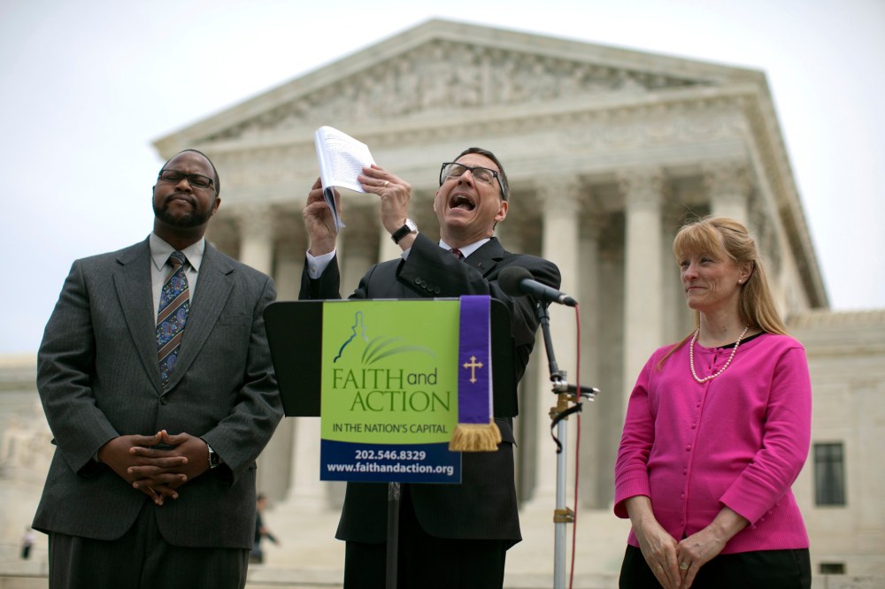 Reverend Dr. Rob Schenck, of Faith and Action, center, speaks in front of the Supreme Court with Raymond Moore, left, and Patty Bills, both also of Faith and Action, during a news conference, Monday, May 5, 2014, in Washington.