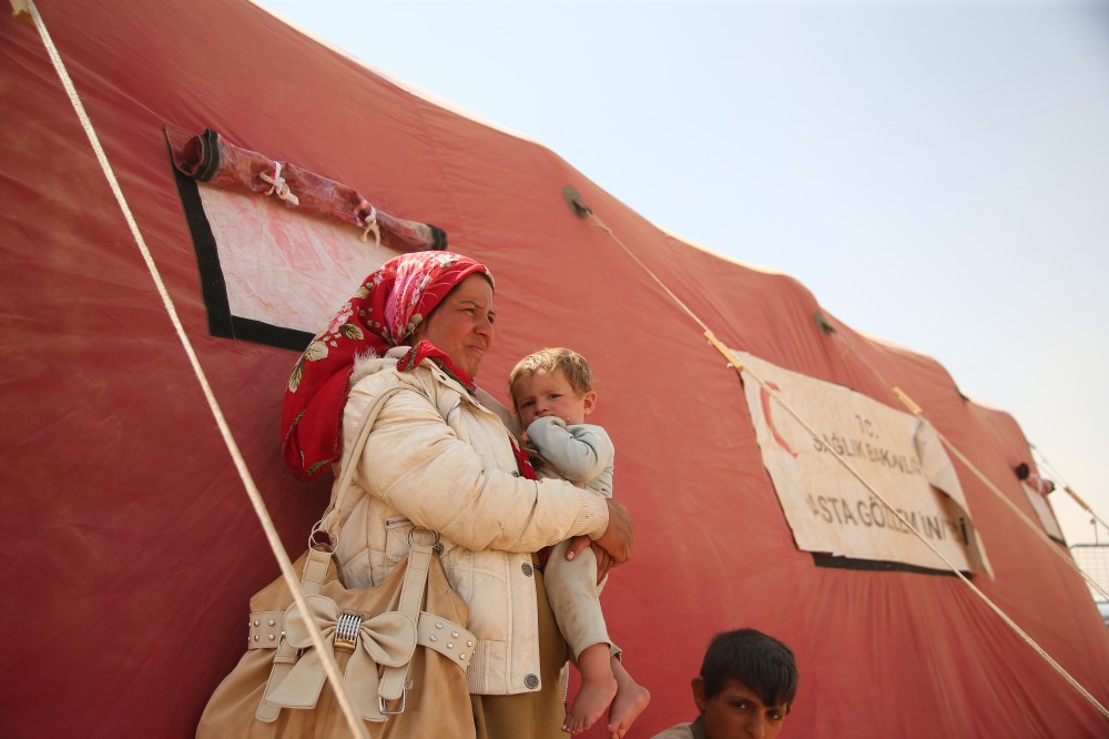 Syrian Kurds Fleeing The Islamic State Militants Cross Into Turkey